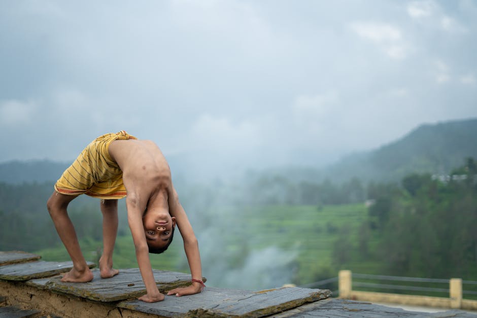 Woman meditating peacefully in a lotus position outdoors surrounded by nature.